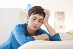 fatigue affecting work ability/multiplesclerosisnewstoday.com/woman resting head on hand
