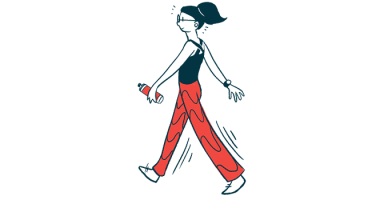 A woman walks briskly while holding a water bottle in one hand.