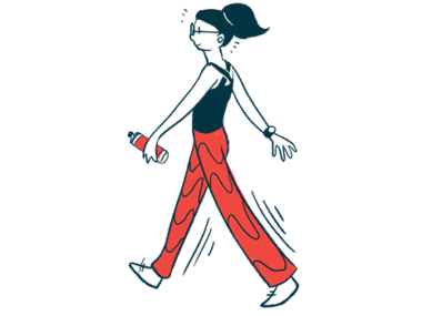 A woman walks briskly while holding a water bottle in one hand.