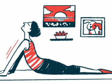 A person uses an exercise mat on the floor to do yoga at home.