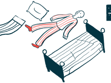 A person lays awake on the floor of a bedroom at nighttime, with a pillow and blanket nearby.