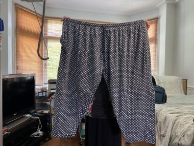 catheterization | Multiple Sclerosis News Today | photo of a pair of loungewear pants behind held aloft