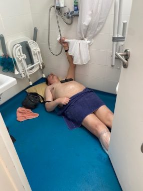 multiple sclerosis falls | Multiple Sclerosis News Today | John lies prone on the wet room floor, grasping a safety bar on the wall, while waiting for emergency assitance