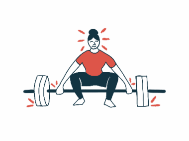 A woman prepares to lift a set of barbells.