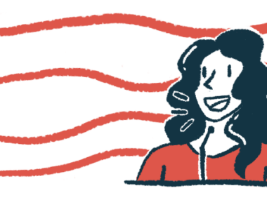 A woman speaks to a group using a microphone.