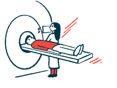 A radiologist stands beside a patient about to undergo an MRI scan.