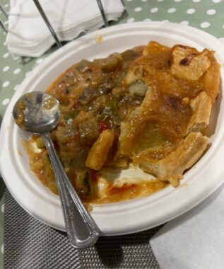 A close-up photo of a wildly unappealing dish of food at a rehab clinic that's part of the U.K.'s National Health Service. The food literally looks like mush and has a spoon in it. 