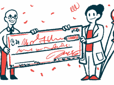 A giant check is presented to a scientist as part of an award for research.