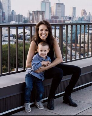 Julie Stamm sits on a ledge with her son, Jack, 7.