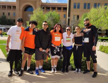 A group of seven people – four men and three women – gather for a photo at the MS walk in San Antonio.
