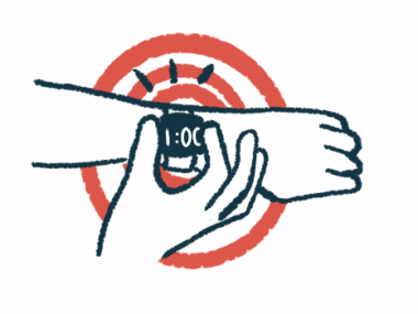 A person's right hand is shown pressing buttons on a smart watch worn on the left wrist.