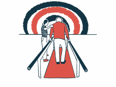 A person holds handrails while walking, assisted by a physical therapist.