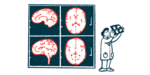 A medical professional views a brain scan with giant brain scan images in the background.