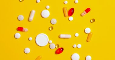 An array of pills and capsules is shown.