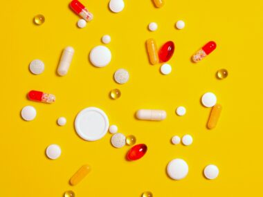 An array of pills and capsules is shown.