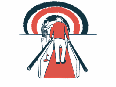 A physiotherapist holds the shoulder of a person walking between two parallel bars.