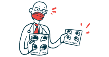 A doctor wearing a face mask holds a pair of imaging scans.