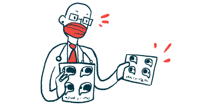 A doctor wearing a face mask holds a pair of imaging scans.