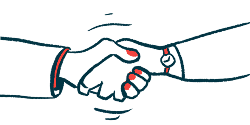 Two people's hands are seen clasped together in this close-up view of a handshake.