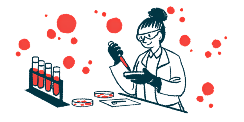 A scientist works with a petri dish in a lab, in front of a rack holding four vials filled with liquid.