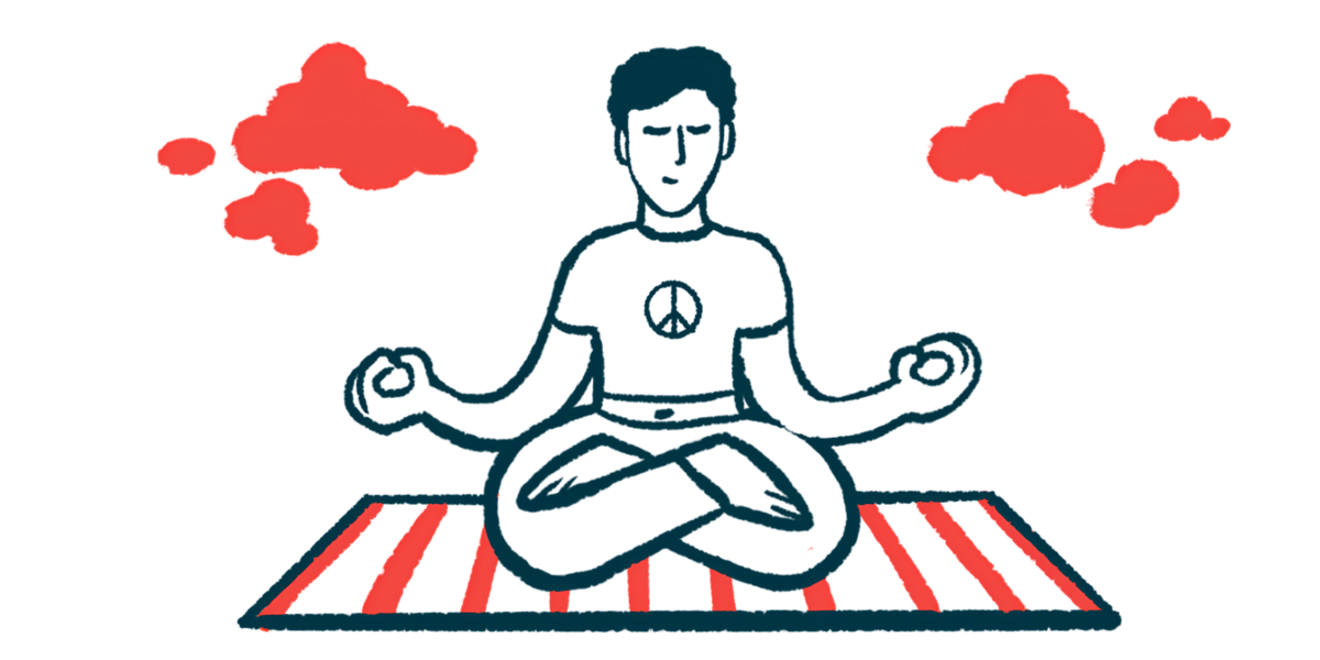A person sits with crossed legs on a striped mat with hands in meditation position.