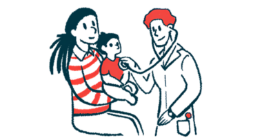 A doctor listens to a child's heart with a stethoscope as she sits on her mother's lap.
