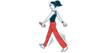 A person with a ponytail walks at a brisk pace while holding a water bottle.