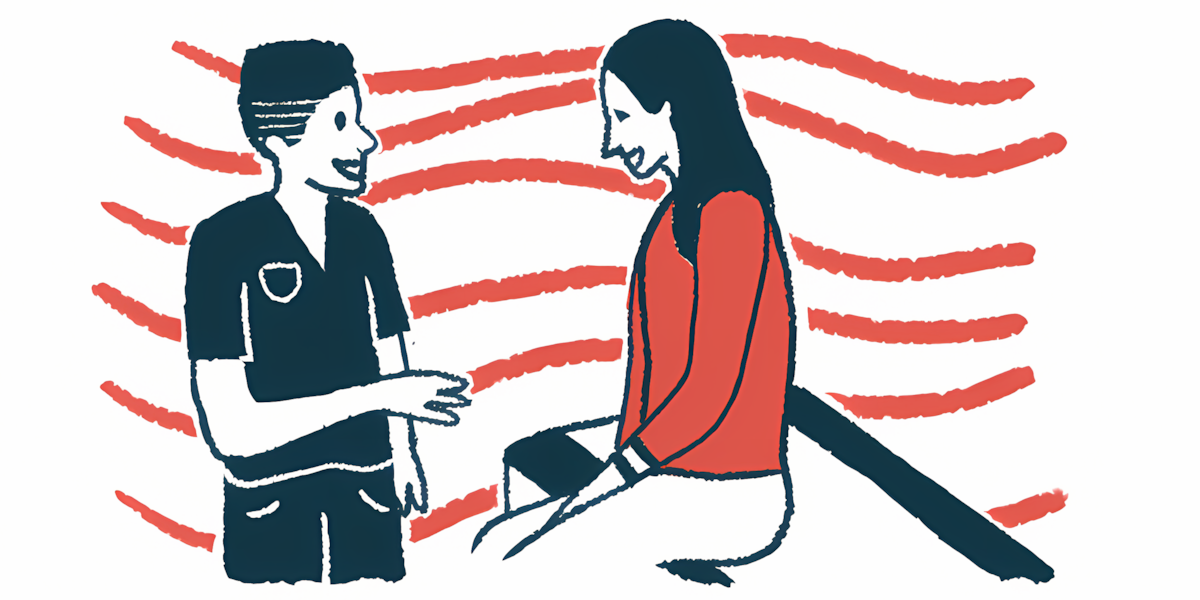 A doctor talks to a patient seated on an examination table.