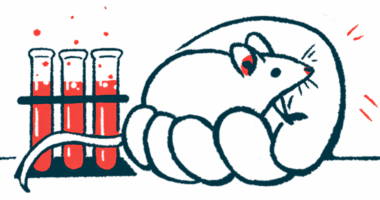 An oversized hand is seen holding a mouse next to a trio of vials in a lab.
