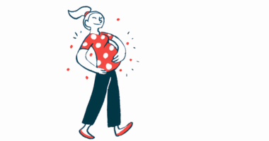 A smiling pregnant woman walks while holding her stomach.