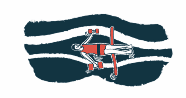 A person floats in water supported by a foam noodle and holding aquatic dumbbells.