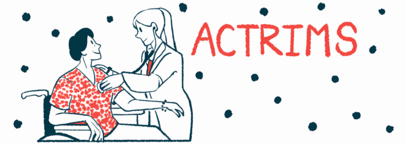 A doctor examines a person in a wheel chair.