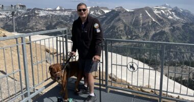 Izzy Abbass and his dog Arkasha are pictured at the gondola's top point in Grand Teton National Park.