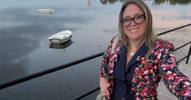 Brittany Boudreau, sporting an orange ribbon pin for MS awareness, takes a selfie while visiting Florida.