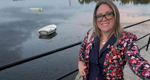 Brittany Boudreau, sporting an orange ribbon pin for MS awareness, takes a selfie while visiting Florida.