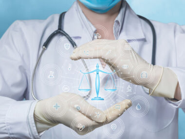 An image of a scale is superimposed over cupped hands of a person wearing a lab coat and stethoscope.