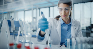 A scientist works in a lab.