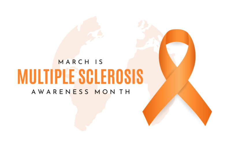 An orange awareness ribbon with text reading “March is Multiple Sclerosis Awareness Month” on a light background.