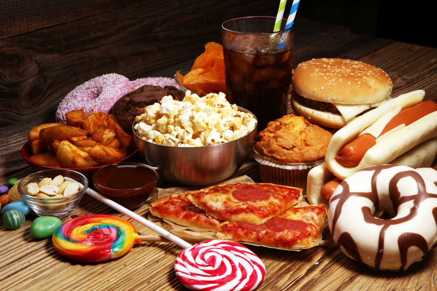An array of highly-processed foods are seen on a table.