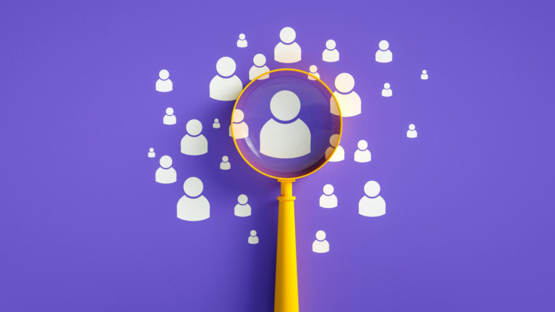 An image shows an array of icons representing people, with one magnified.