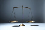 A photo shows a balance scale.