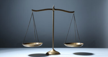 A photo shows a balance scale.