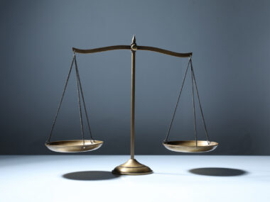 A photo shows a balance scale.