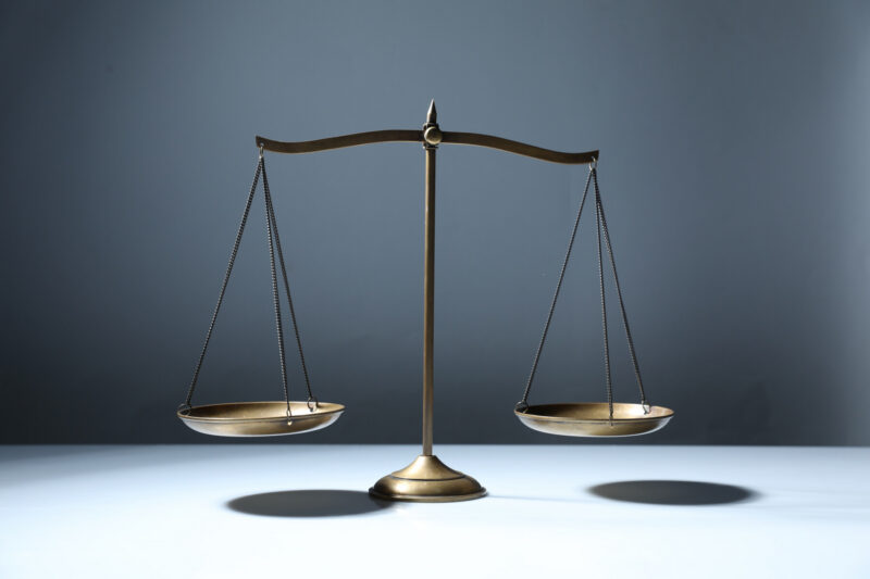 A photo shows a balance scale.