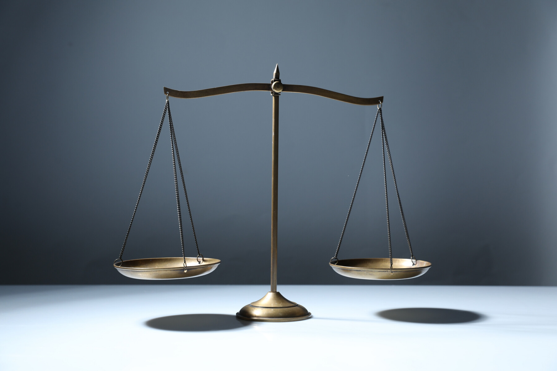 A photo shows a balance scale.