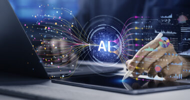A photo of a hand using a stylus near digital AI graphics, data lines, and charts on a screen.