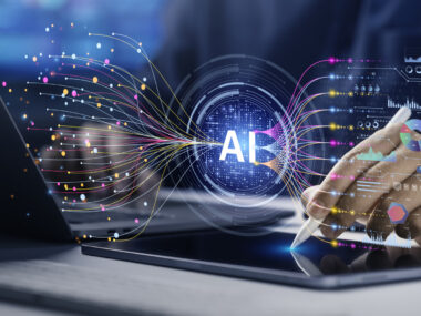 A photo of a hand using a stylus near digital AI graphics, data lines, and charts on a screen.