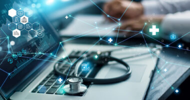 A graphic showing healthcare information is superimposed over an image of a stethoscope resting on the keyboard of an open laptop.
