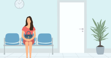 A person sits in a waiting room.