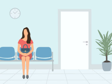 A person sits in a waiting room.